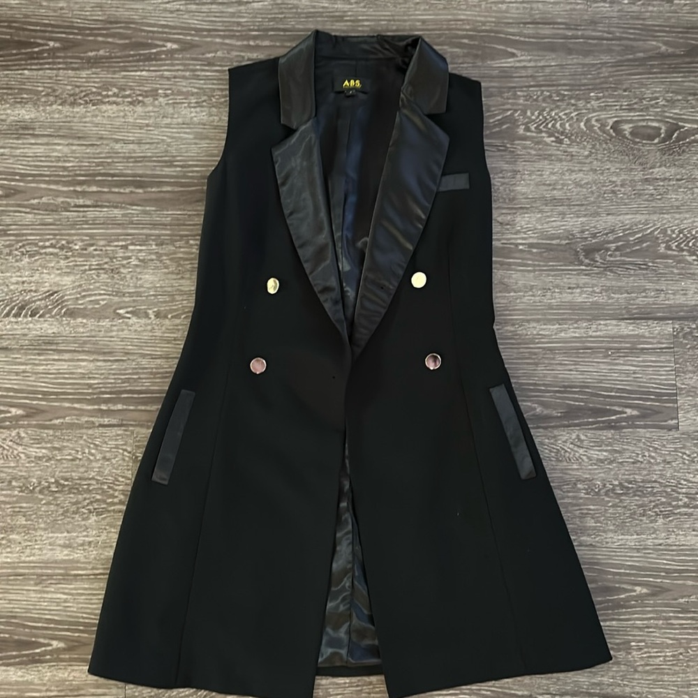 Black sleeveless blazer with satin detail